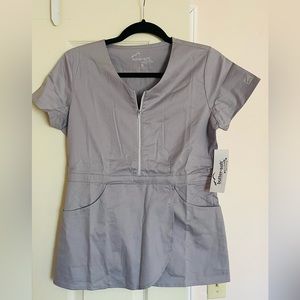 Buttersoft peplum scrub top with two side pockets and quarter zip